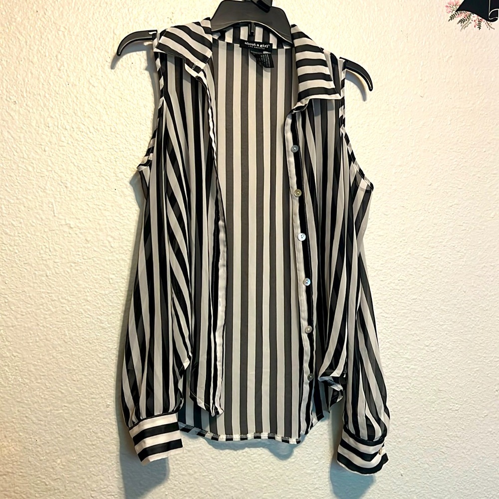 Gorgeous black and white blouse with shoulder cut-outs.  Sheer & button down.